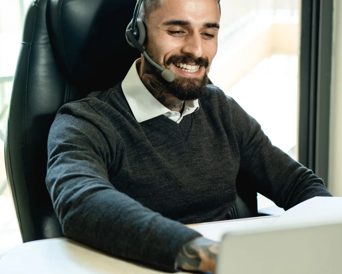 Professional dictating at his desk with a headset microphone